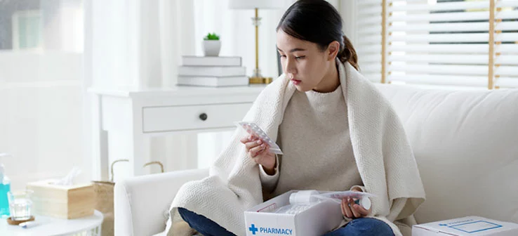 woman opening prescription delivery